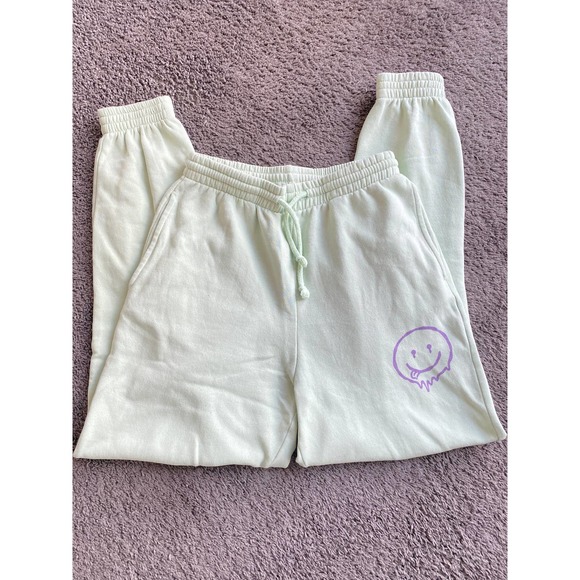Divided Mint green joggers with purple smiley face, size XS - Picture 2 of 7